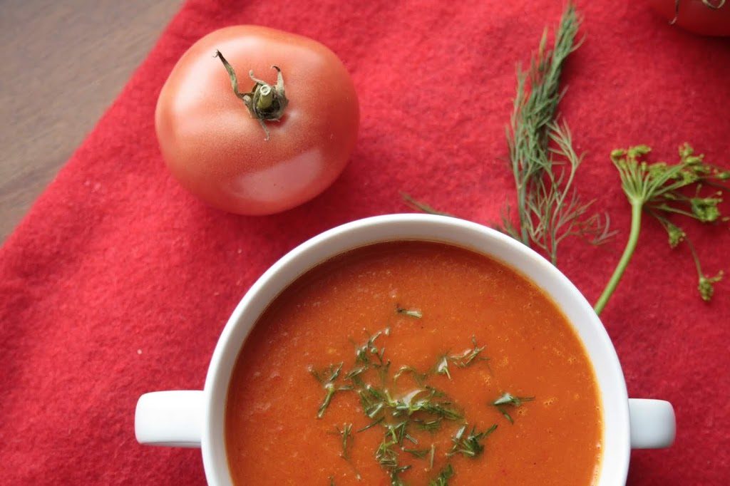 Hot red pepper and tomato soup, served with dill
