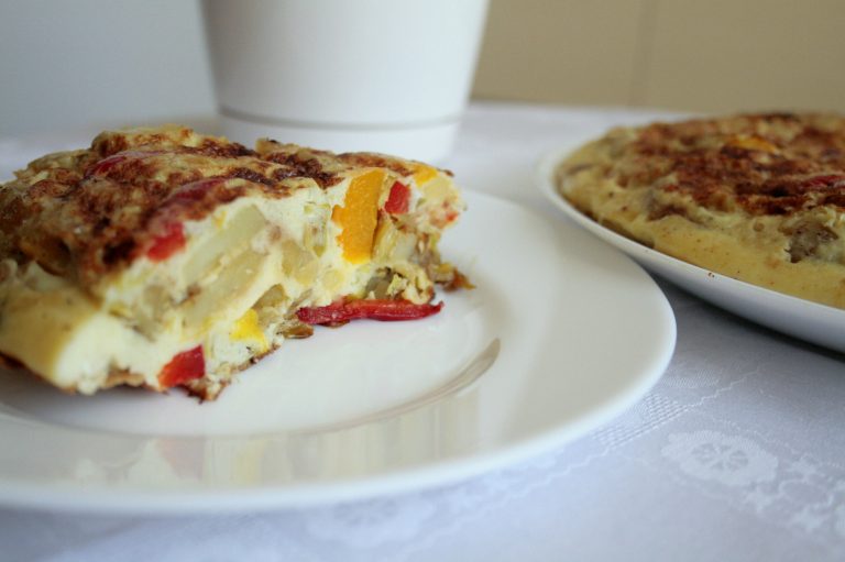 A slice of a Low FODMAP Spanish Omelette